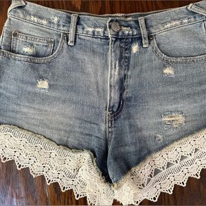 Free People denim jean shorts with lace edge. W28